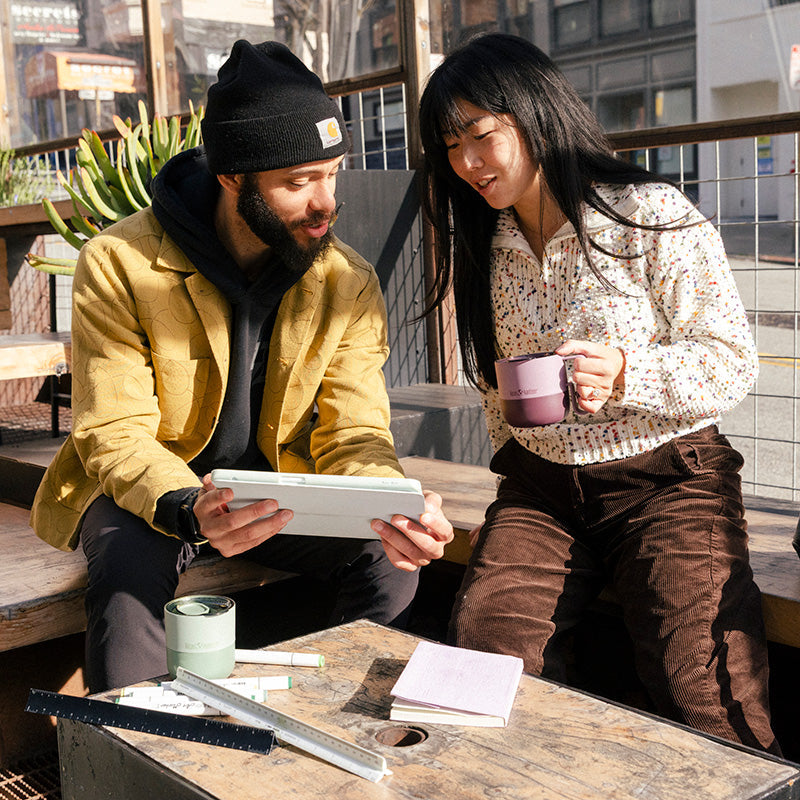 12oz-rise-mug-s0 12oz_rise_coffee_mug_dusty_orchid_couple_city_patio_square.jpg