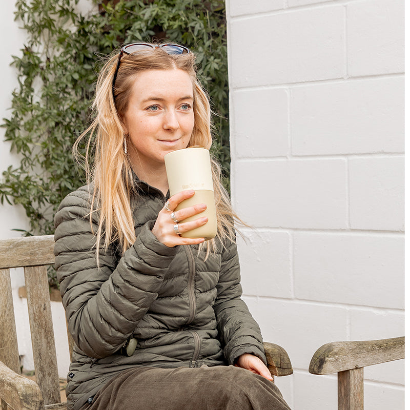 16oz-rise-tumbler-c3 16oz_rise_tumbler_wax_yellow_woman_seat_outside_square.jpg