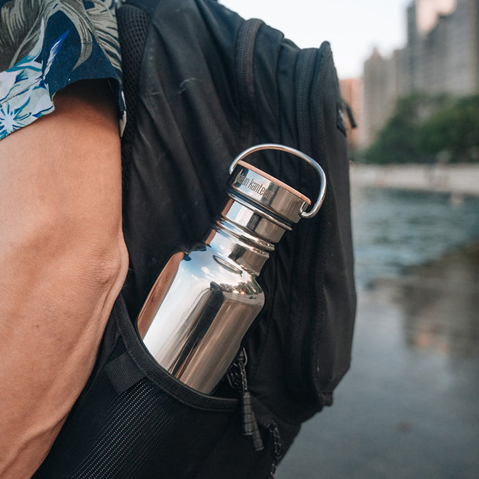 27oz-reflect-with-bamboo-cap-x1 K27SSLRF-MS-BAMBOO_reflect-bottle_backpack_lifestyle.jpg